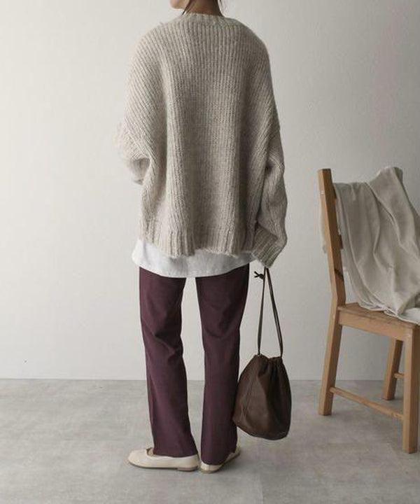 Oversized beige sweater with front pockets