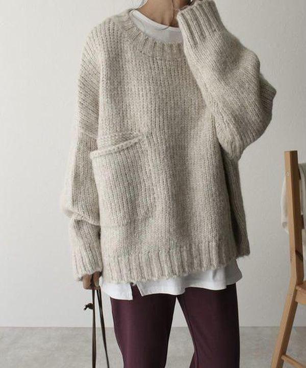 Oversized beige sweater with front pockets