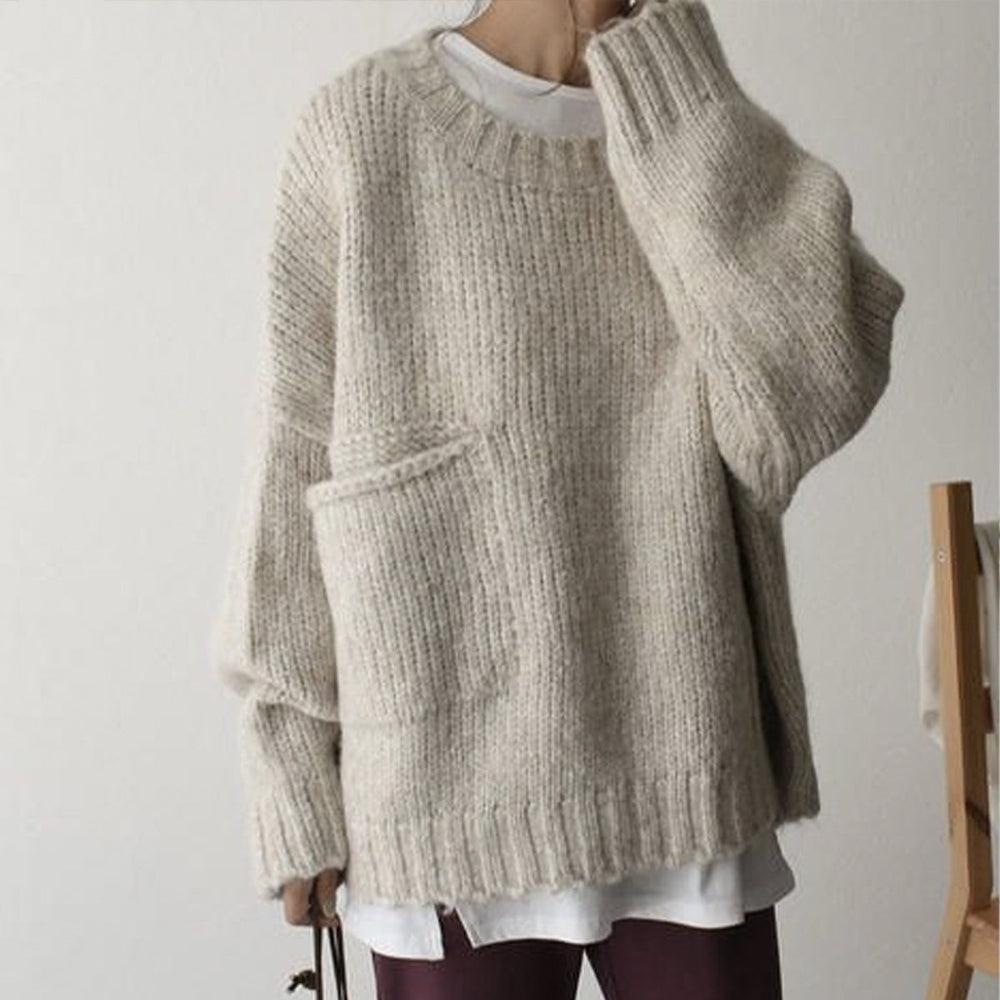 Oversized beige sweater with front pockets