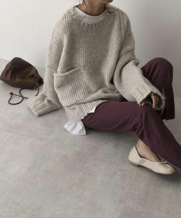 Oversized beige sweater with front pockets